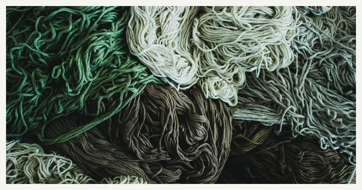 Tangled coils of green, white, gray and brown rope.